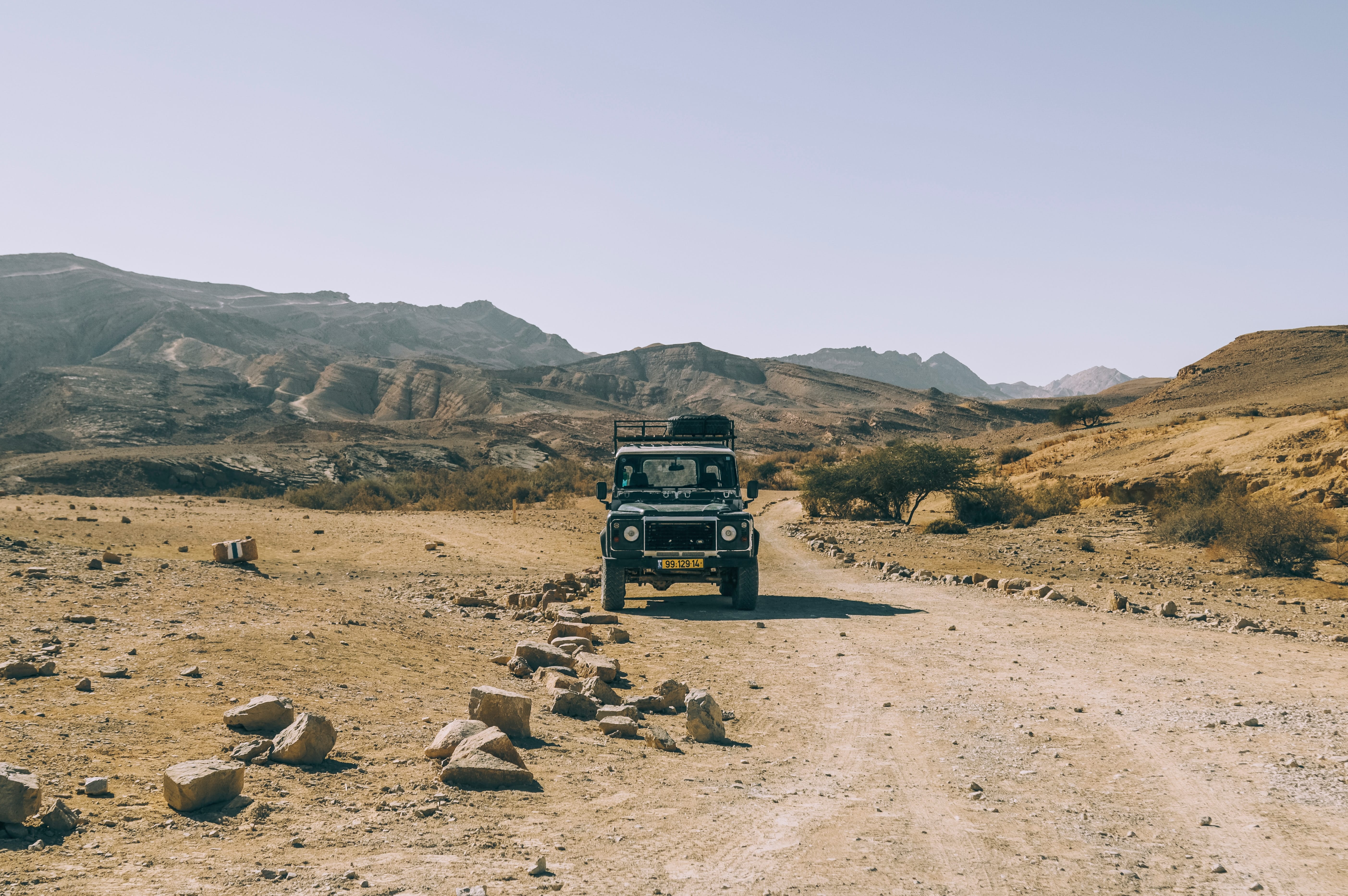 Land Rover Defender On A Road With Rocks